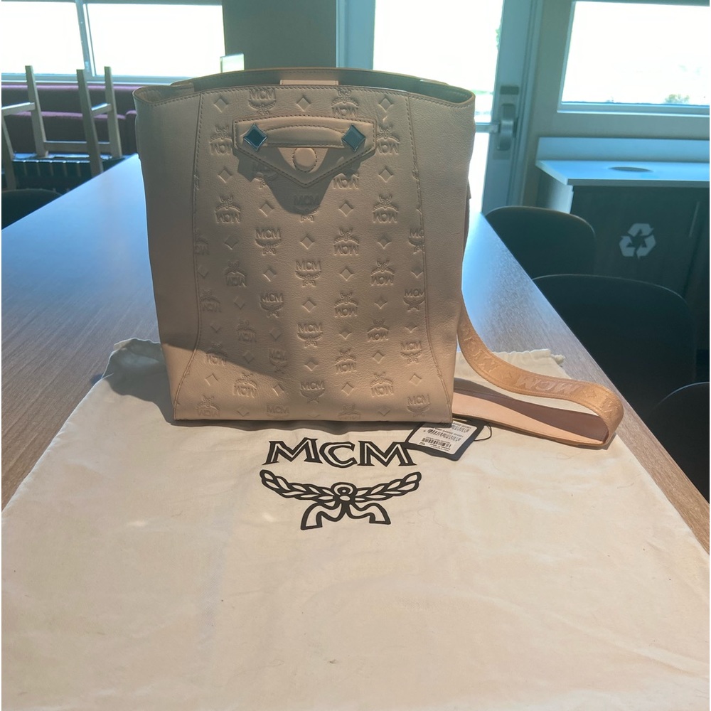 Authentic MCM Medium Hobo Bag in Beige 
never used. Comes with dust bag